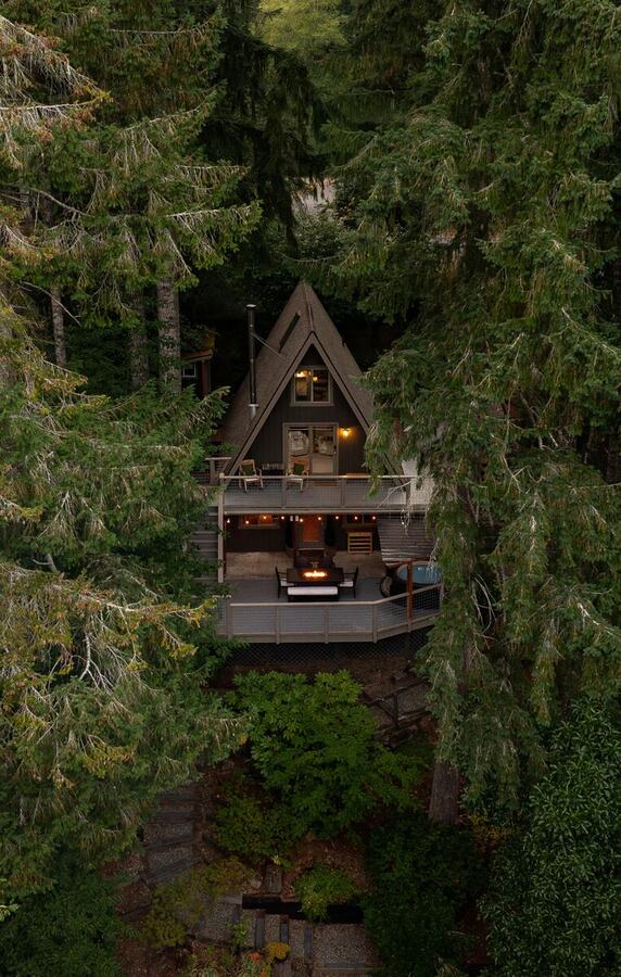 The A-frame tucked in among the fir trees above the lake