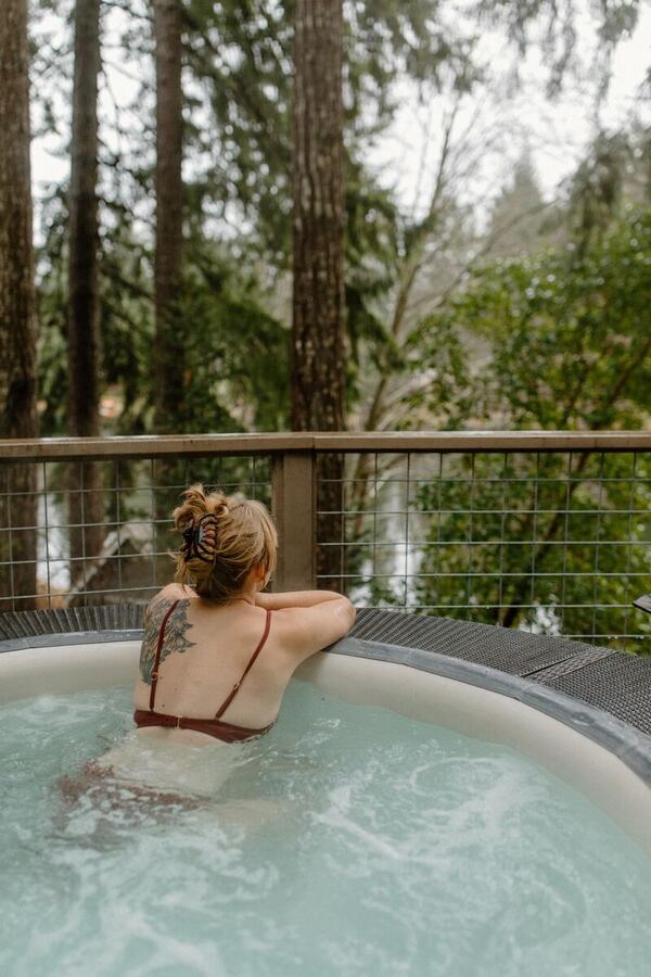 Relaxing in the hot tub looking out into the trees