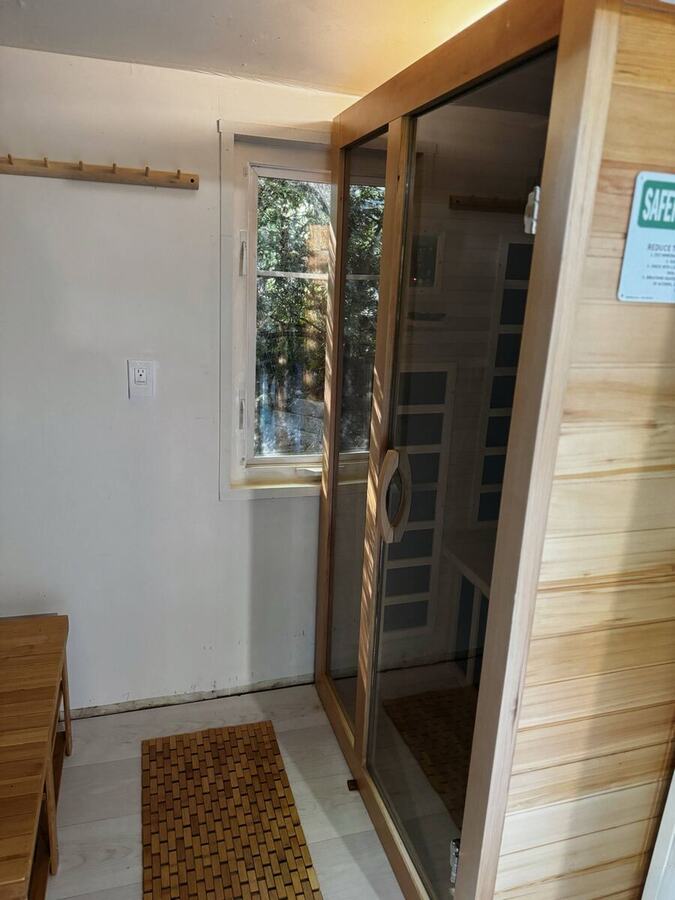 The cedar door to the infrared sauna just off the deck